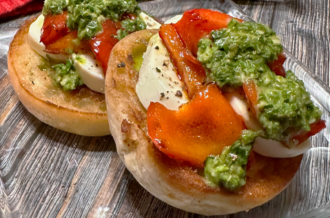 BAYS TOPPED WITH MOZZARELLA TOMATO AND PESTO