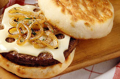 A BEEF PATTY WITH CHEESE ON A BAYS ENGLISH MUFFIN